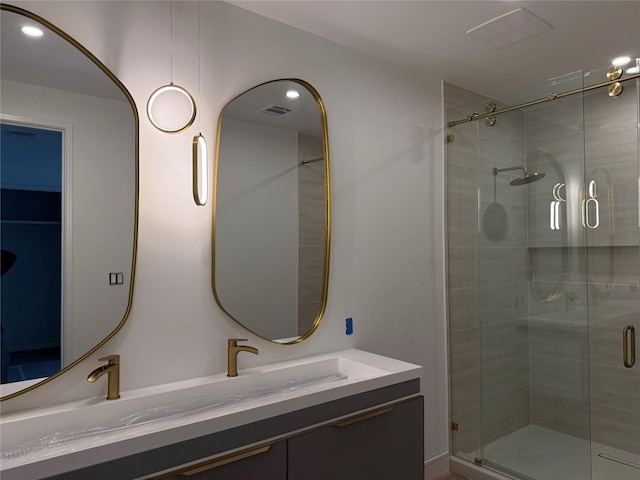 full bathroom with visible vents, recessed lighting, a stall shower, and vanity