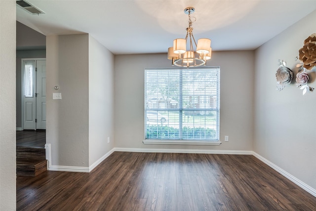 unfurnished dining area with visible vents, baseboards, dark wood-type flooring, and a chandelier