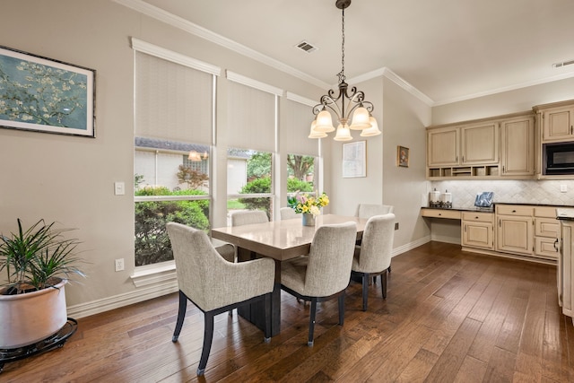 dining space featuring visible vents, crown molding, dark wood-type flooring, and a notable chandelier