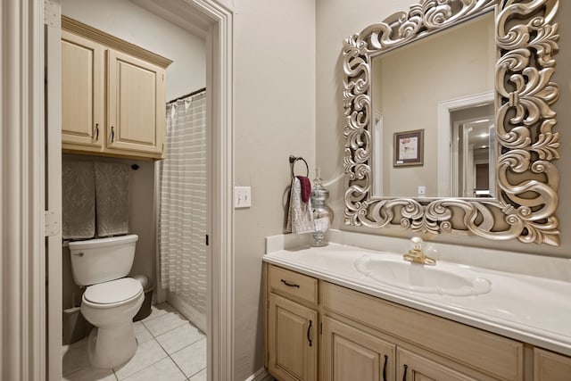 bathroom featuring tile patterned floors, vanity, and toilet