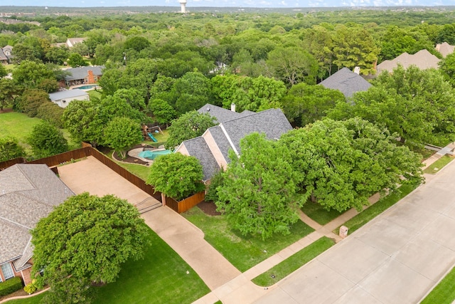 bird's eye view featuring a wooded view