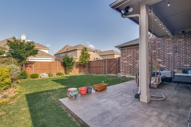 view of yard featuring a wooden deck and a fenced backyard