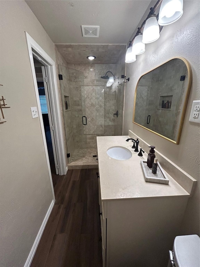 2118 Lansdowne Dr, Garland, TX 75040 - home office with baseboards, ceiling fan, a healthy amount of sunlight, and wood finished floors