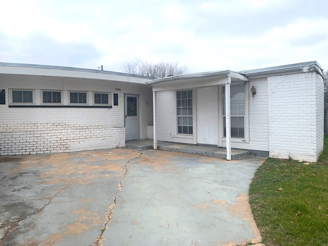 view of front of home with brick siding