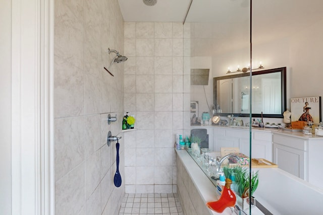 bathroom with vanity and tiled shower