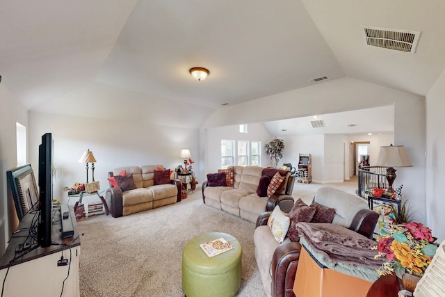 carpeted living room featuring visible vents, plenty of natural light, and lofted ceiling