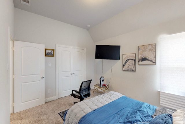 bedroom with visible vents, carpet floors, baseboards, a closet, and lofted ceiling