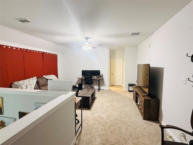 bedroom featuring baseboards, visible vents, light carpet, and ceiling fan