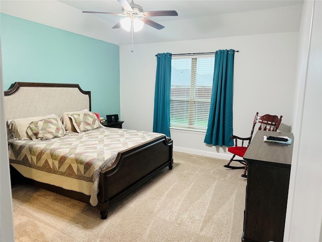 bedroom featuring baseboards, a ceiling fan, and light colored carpet