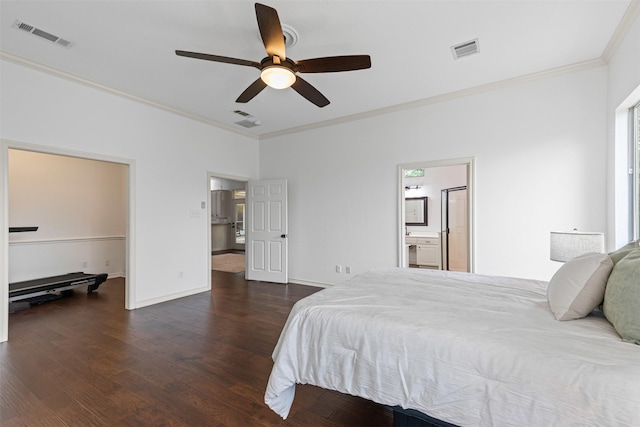 bedroom featuring crown molding, wood finished floors, and visible vents