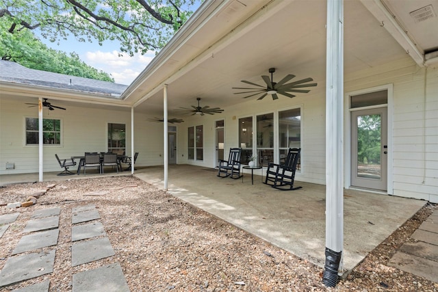 view of patio with ceiling fan and visible vents