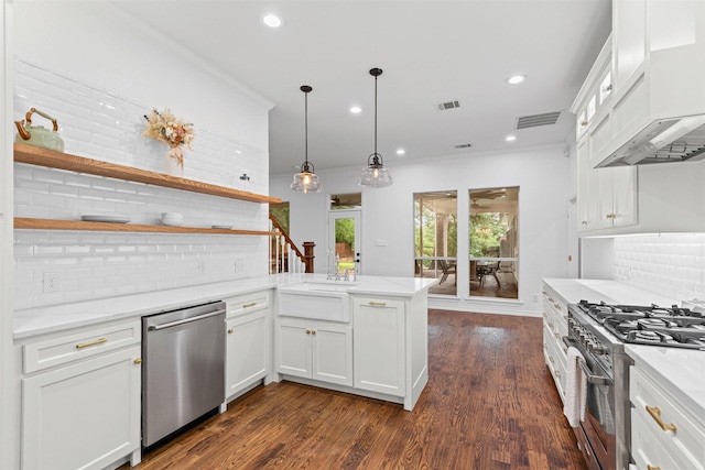 kitchen with stainless steel appliances, a peninsula, backsplash, visible vents, and custom exhaust hood