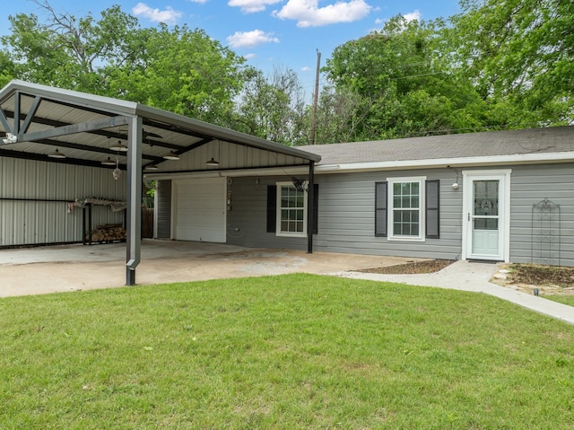 view of front of house featuring a garage, driveway, a front yard, and a carport
