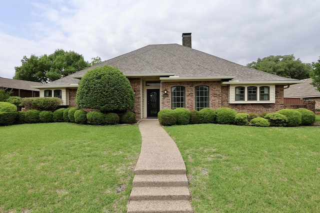 3509 Arbuckle Dr, Plano, TX 75075 - ranch-style house featuring a shingled roof, a chimney, and a front lawn