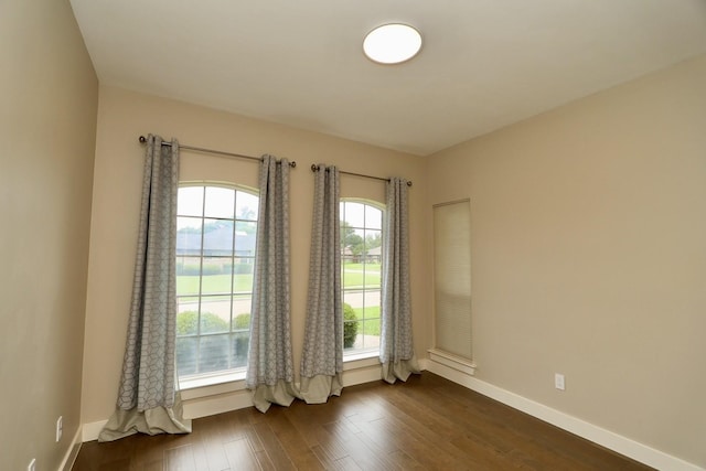 3509 Arbuckle Dr, Plano, TX 75075 - unfurnished room featuring baseboards and dark wood finished floors