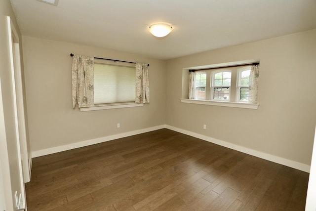 3509 Arbuckle Dr, Plano, TX 75075 - empty room featuring baseboards and dark wood-style flooring