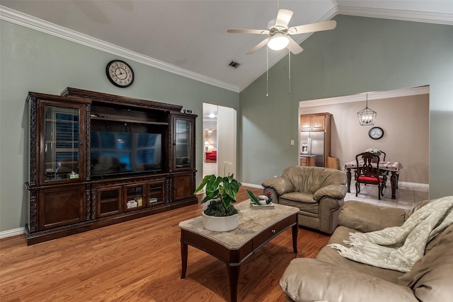 3788 Zion Rd, Garland, TX 75043 - living room featuring crown molding, light wood-style floors, a ceiling fan, baseboards, and visible vents