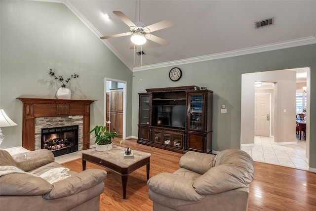 3788 Zion Rd, Garland, TX 75043 - living area featuring a ceiling fan, visible vents, vaulted ceiling, baseboards, and light wood-style flooring
