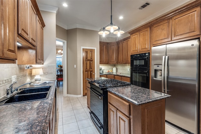3788 Zion Rd, Garland, TX 75043 - kitchen with brown cabinetry, backsplash, visible vents, a sink, and black appliances