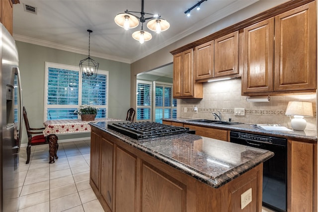 3788 Zion Rd, Garland, TX 75043 - kitchen with visible vents, brown cabinets, a chandelier, a sink, and black appliances