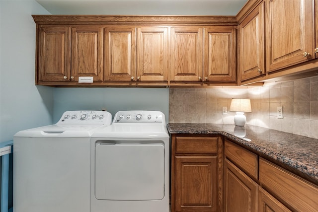 3788 Zion Rd, Garland, TX 75043 - washroom featuring washer and clothes dryer and cabinet space