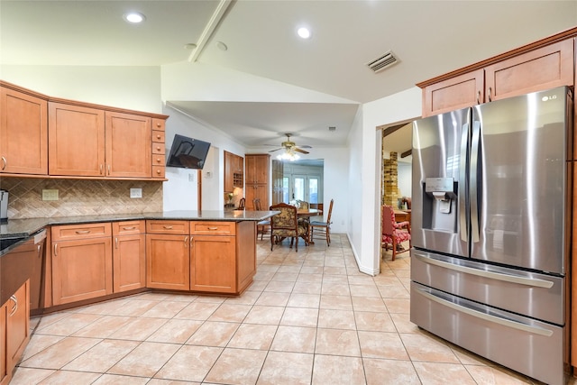 kitchen with ceiling fan, visible vents, appliances with stainless steel finishes, vaulted ceiling, and light tile patterned floors