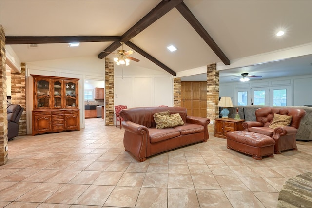living room with a ceiling fan, light tile patterned floors, vaulted ceiling with beams, and ornate columns