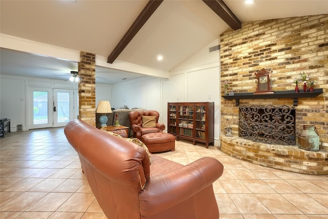 living room with ceiling fan, a decorative wall, vaulted ceiling with beams, light tile patterned floors, and visible vents