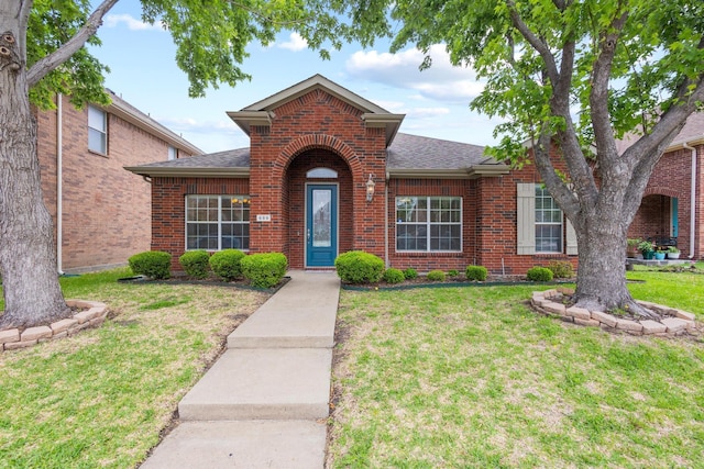 689 Bonham Dr, Lavon, TX 75166 - view of front facade featuring brick siding, a shingled roof, and a front lawn