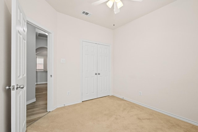 689 Bonham Dr, Lavon, TX 75166 - unfurnished bedroom featuring visible vents, a closet, light carpet, baseboards, and arched walkways