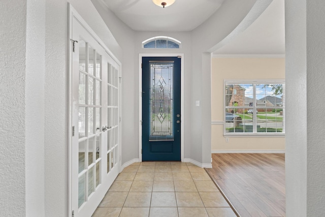 689 Bonham Dr, Lavon, TX 75166 - foyer featuring french doors, baseboards, a wealth of natural light, and wood finished floors