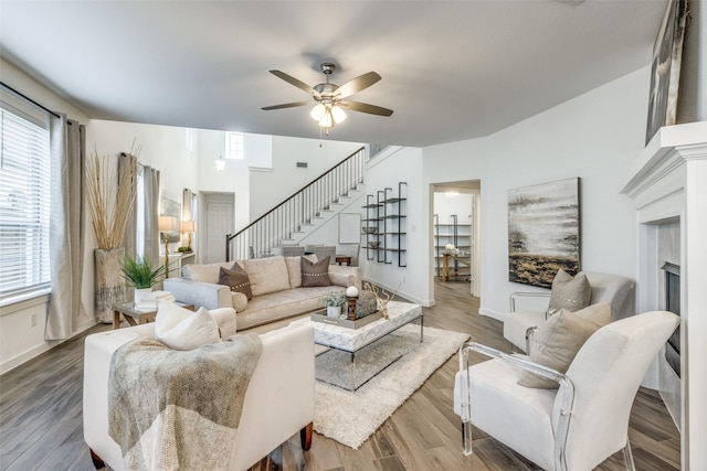 1213 Shire, Aubrey, TX 76227 - living area with ceiling fan, visible vents, a fireplace, wood finished floors, and stairway