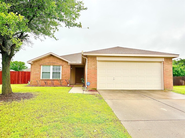 ranch-style home with fence, driveway, a front lawn, and brick siding