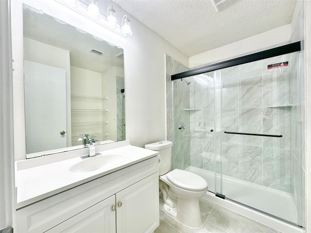 bathroom with visible vents, a textured ceiling, a stall shower, and toilet