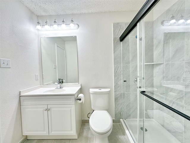 full bathroom featuring vanity, toilet, a textured ceiling, tile patterned floors, and a shower stall