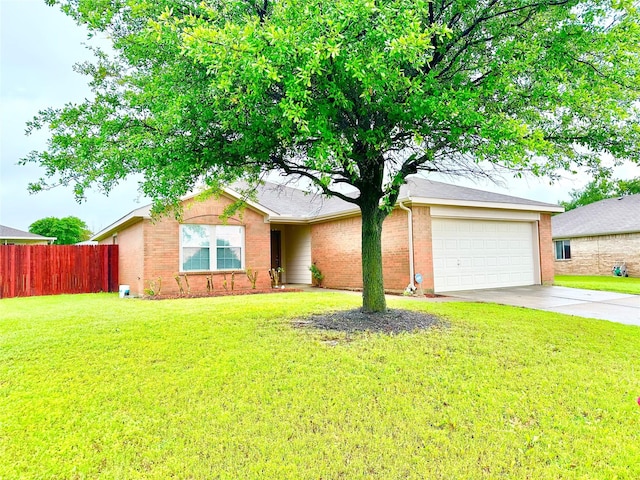 ranch-style house featuring fence, a front lawn, brick siding, a garage, and driveway