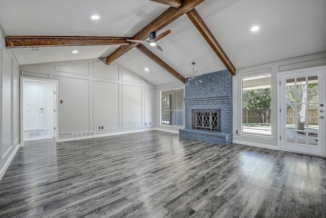1441 Marlene Pl, Desoto, TX 75115 - unfurnished living room featuring lofted ceiling with beams, dark wood finished floors, visible vents, and a decorative wall