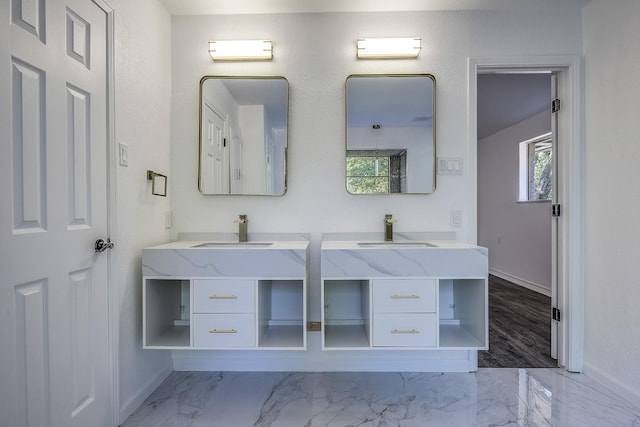 1441 Marlene Pl, Desoto, TX 75115 - bathroom with baseboards, two vanities, a sink, and marble finish floor