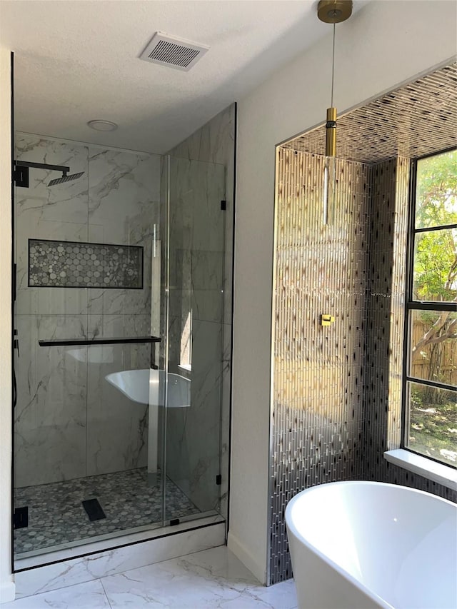 1441 Marlene Pl, Desoto, TX 75115 - full bathroom featuring visible vents, a marble finish shower, a soaking tub, and marble finish floor