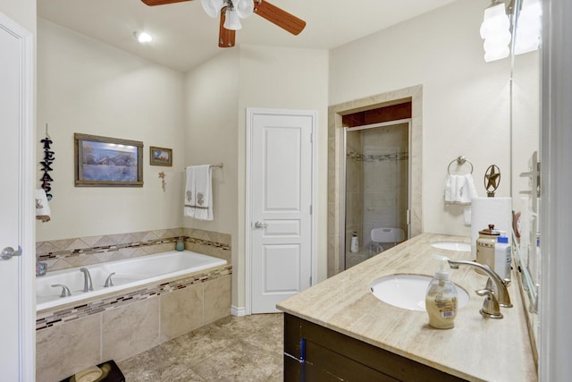 bathroom featuring double vanity, ceiling fan, a garden tub, a stall shower, and a sink