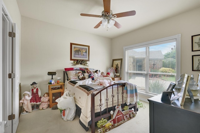 bedroom with carpet floors, ceiling fan, and multiple windows