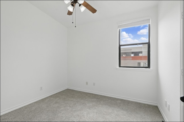 empty room featuring carpet floors, ceiling fan, and baseboards