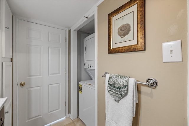 clothes washing area with laundry area and stacked washer / dryer