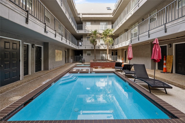 pool featuring a hot tub