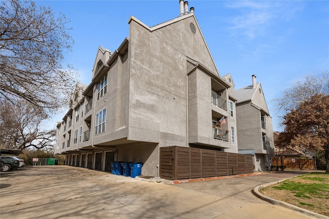 view of side of home featuring stucco siding