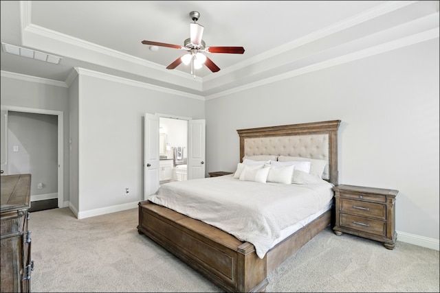 bedroom with crown molding, light carpet, ensuite bath, baseboards, and visible vents