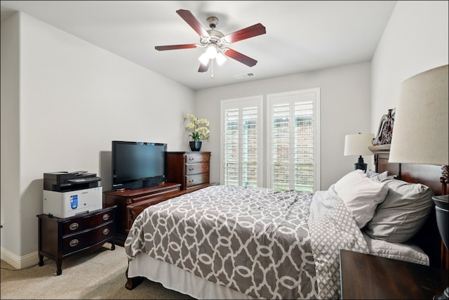 bedroom featuring visible vents, carpet flooring, baseboards, and ceiling fan