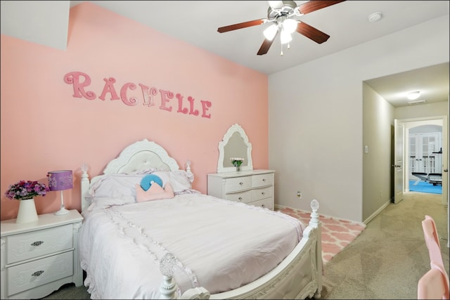 carpeted bedroom featuring ceiling fan and baseboards
