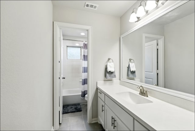 bathroom featuring visible vents, vanity, shower / bath combination with curtain, toilet, and tile patterned floors