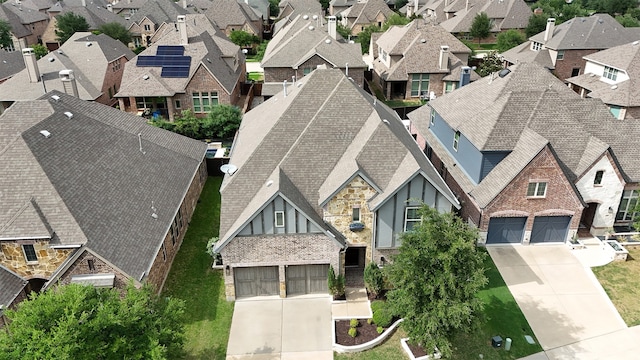 birds eye view of property with a residential view